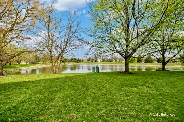 a living room with furniture fireplace and window