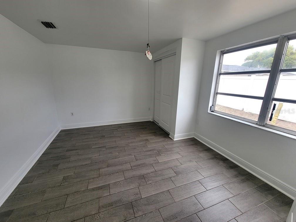 7730 Wicklow Street New Port Richey, FL 34653 - Photo 16 of 19 an empty room with a window