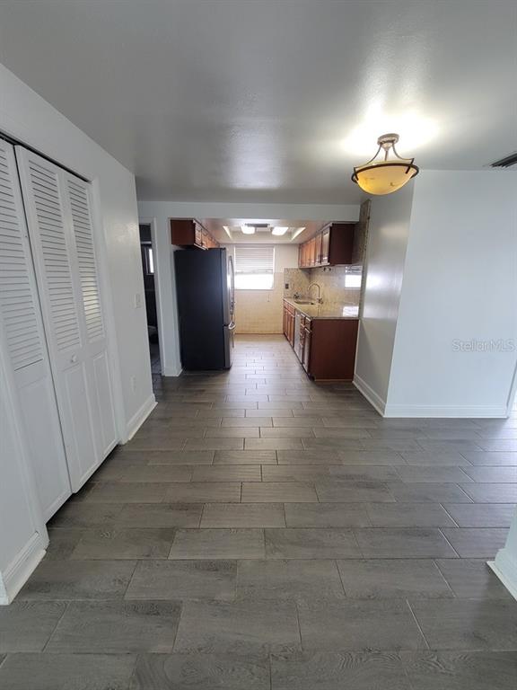 7730 Wicklow Street New Port Richey, FL 34653 - Photo 6 of 19 a view of a room with wooden floor