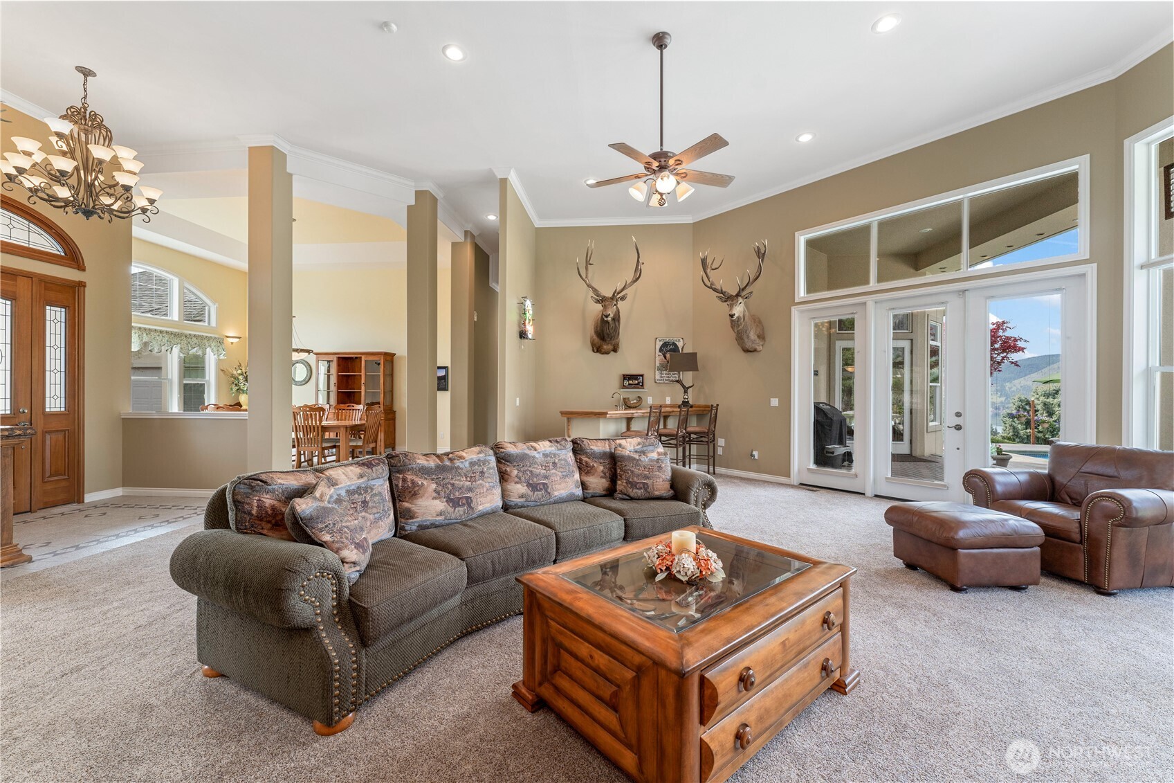 1845 Summit Boulevard Manson, WA 98831 - Photo 18 of 40 a living room with furniture a chandelier and a chandelier