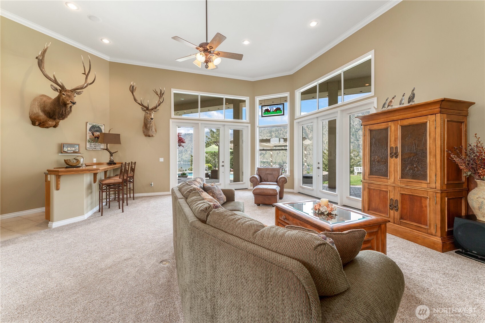 1845 Summit Boulevard Manson, WA 98831 - Photo 19 of 40 a living room with furniture ceiling fan and a rug