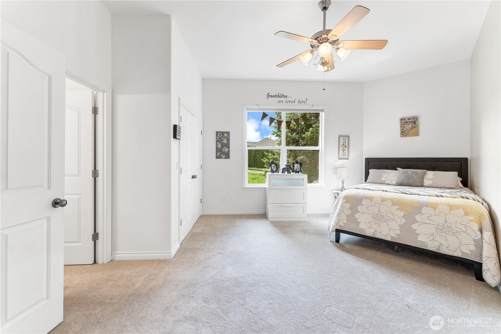 1845 Summit Boulevard Manson, WA 98831 - Photo 28 of 40 a bedroom with a bed and a chandelier