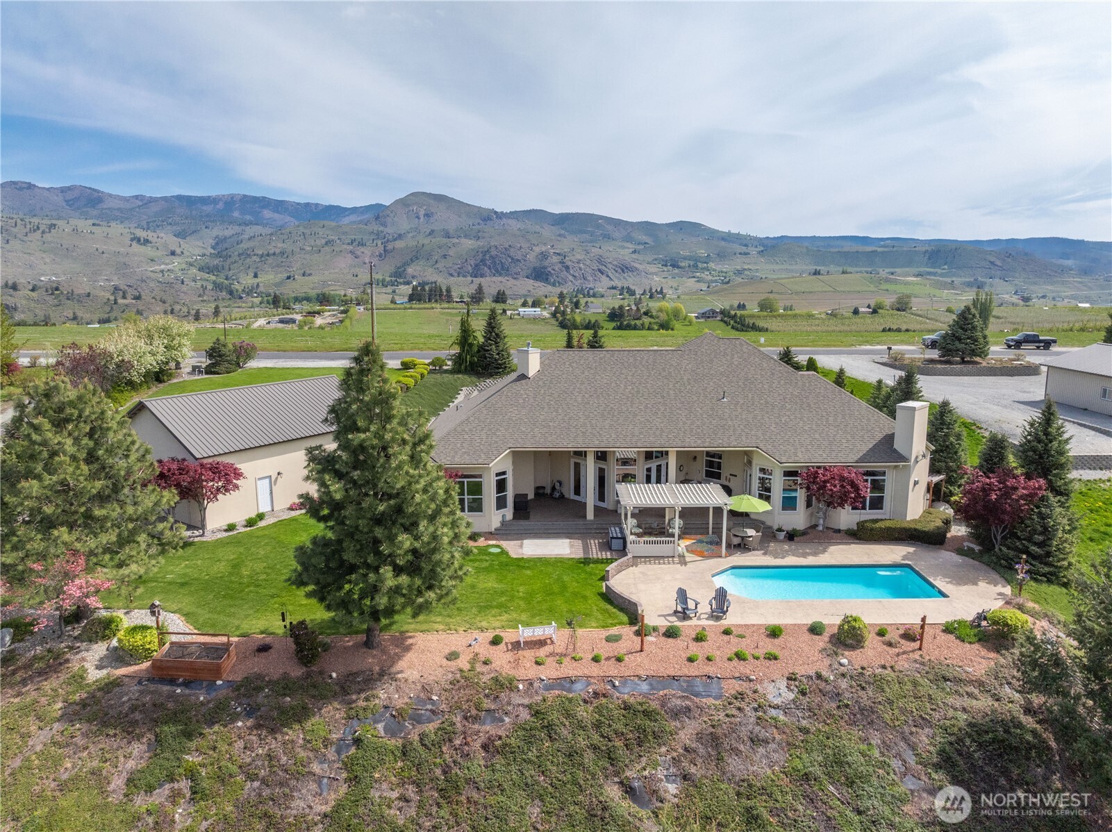 1845 Summit Boulevard Manson, WA 98831 - Photo 31 of 40 an aerial view of a house with a garden