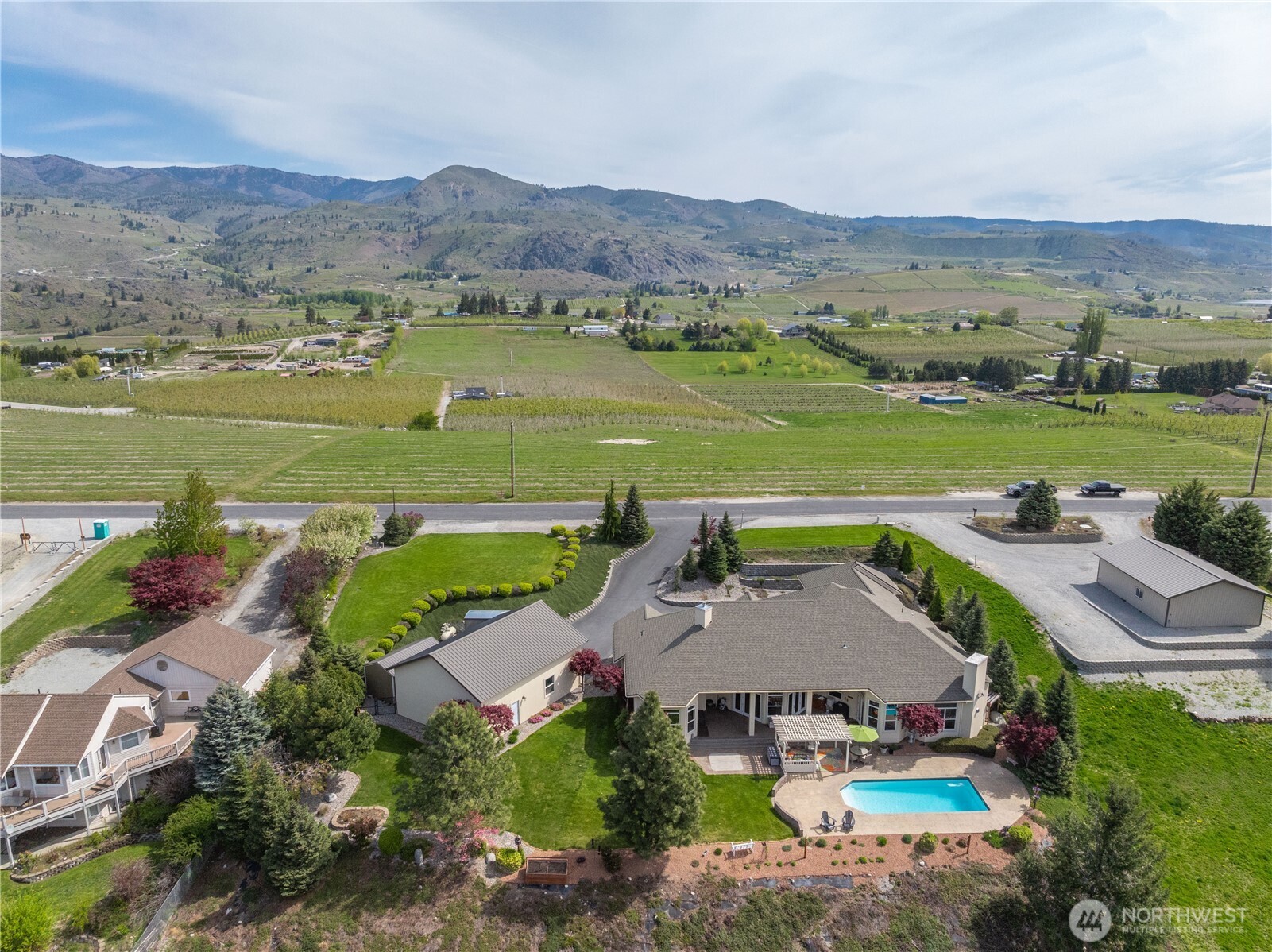 1845 Summit Boulevard Manson, WA 98831 - Photo 35 of 40 an aerial view of a house with a garden and lake view
