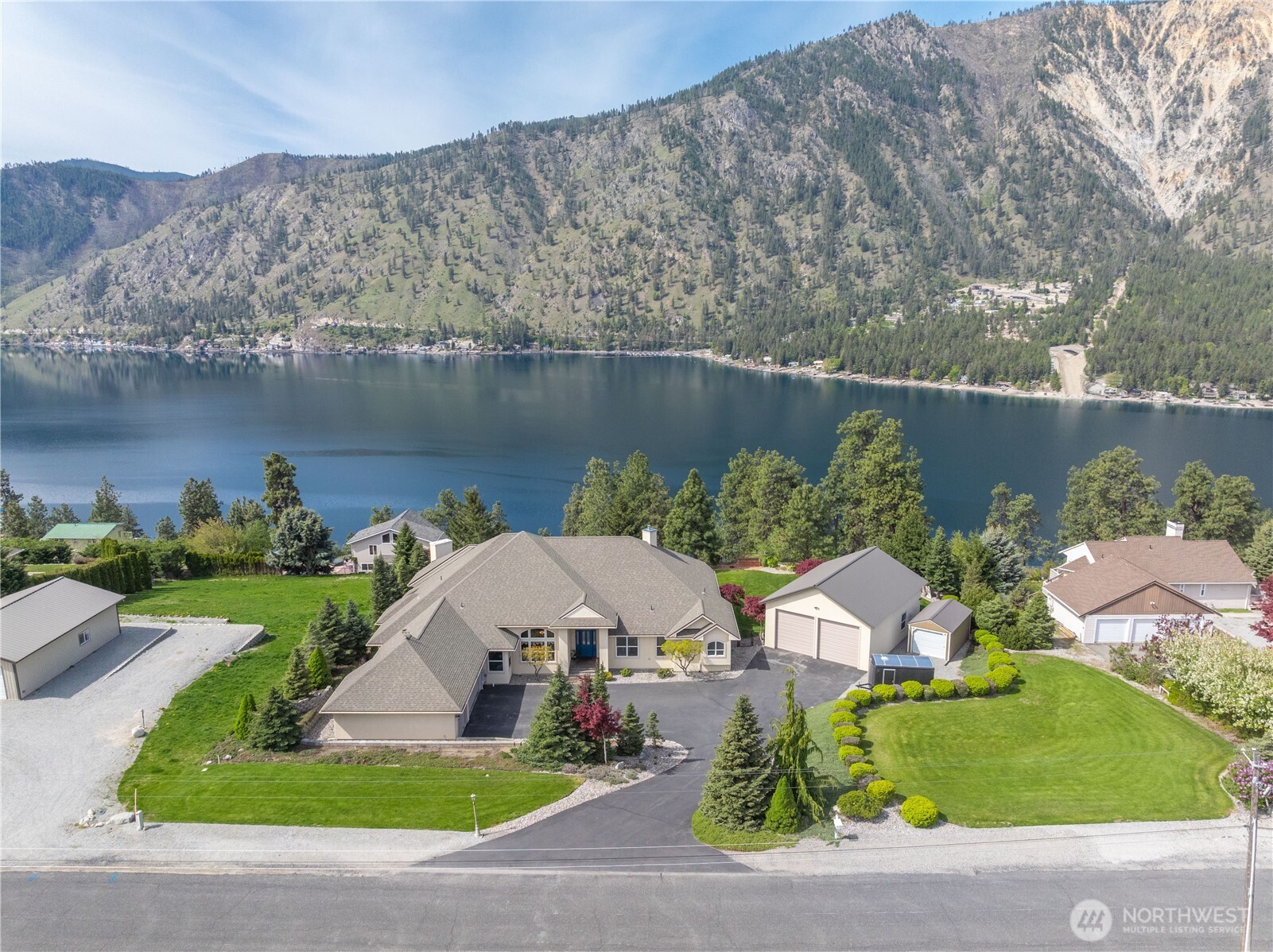1845 Summit Boulevard Manson, WA 98831 - Photo 36 of 40 an aerial view of a house with a garden and lake view