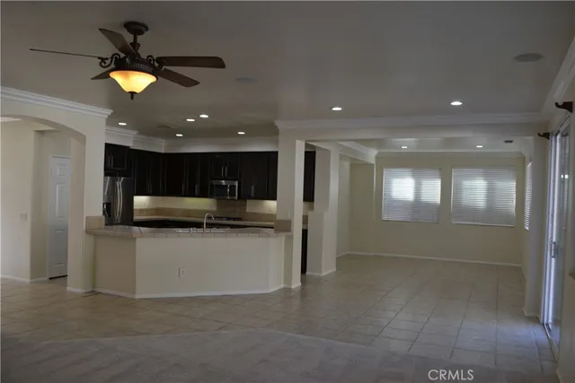 a kitchen with a refrigerator and a sink