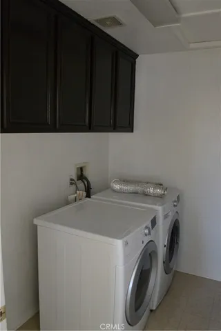 a view of a room with a window and a ceiling fan