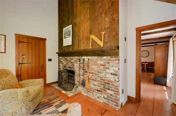 19 Oak Ridge Road Littleton, MA 01460 - Photo 13 of 30 a bedroom with a bed and a fireplace