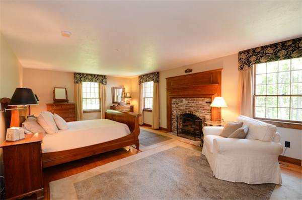 19 Oak Ridge Road Littleton, MA 01460 - Photo 14 of 30 a bedroom with furniture and a fireplace