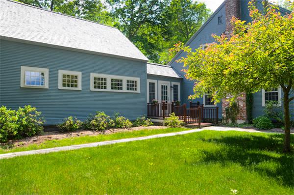 19 Oak Ridge Road Littleton, MA 01460 - Photo 2 of 30 a front view of a house with garden