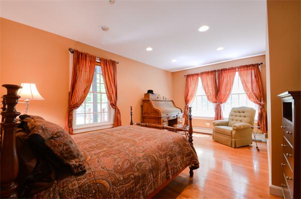 19 Oak Ridge Road Littleton, MA 01460 - Photo 21 of 30 a bed room with a bed and a couch