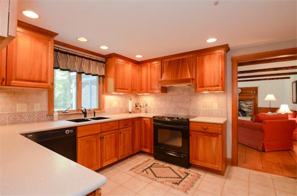 19 Oak Ridge Road Littleton, MA 01460 - Photo 7 of 30 a kitchen with stainless steel appliances granite countertop a sink stove and refrigerator
