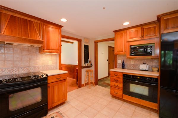 19 Oak Ridge Road Littleton, MA 01460 - Photo 8 of 30 a kitchen with stainless steel appliances a stove a sink and a microwave
