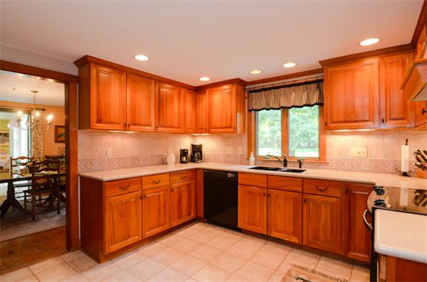 19 Oak Ridge Road Littleton, MA 01460 - Photo 9 of 30 a kitchen with a sink window and cabinets