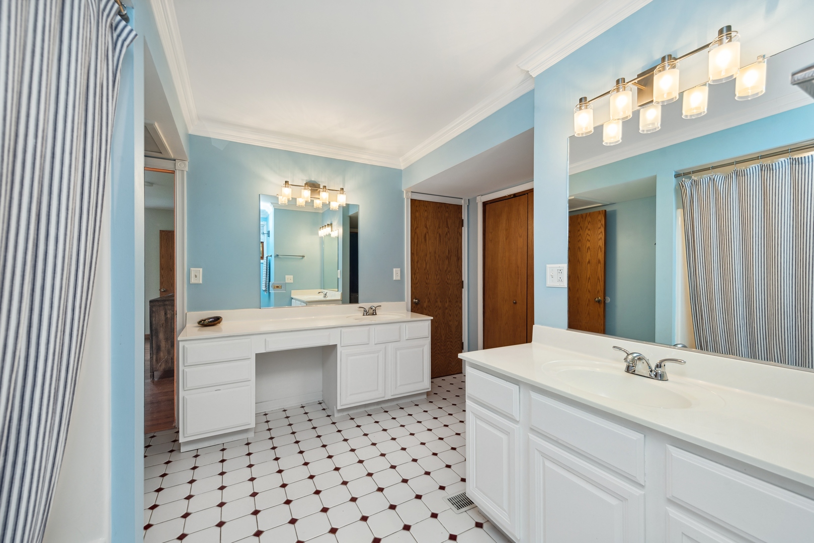 908 Pershing Drive Wauconda, IL 60084 - Photo 14 of 38 a bathroom with a sink a toilet and a mirror