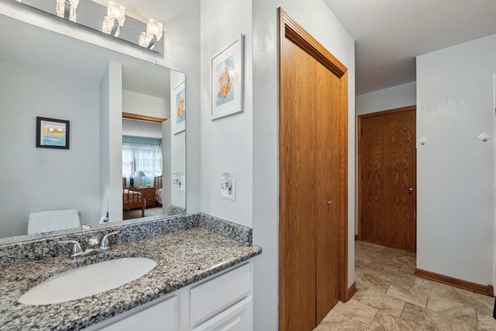 908 Pershing Drive Wauconda, IL 60084 - Photo 18 of 38 a bathroom with a granite countertop sink and a mirror
