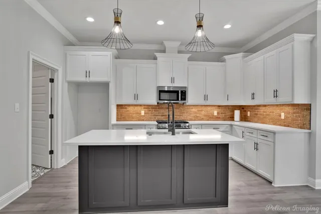 a view of empty room with wooden floor and fireplace