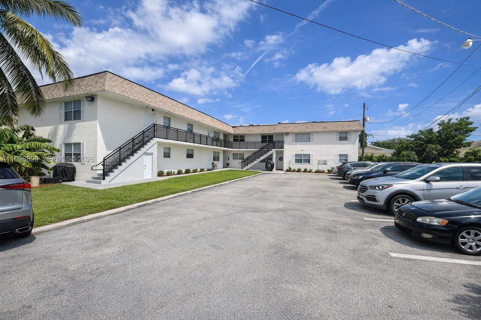 2521 Pierce Street, Unit 2 Hollywood, FL 33020 - Photo 11 of 11 a view of a house with a cars park side of a road