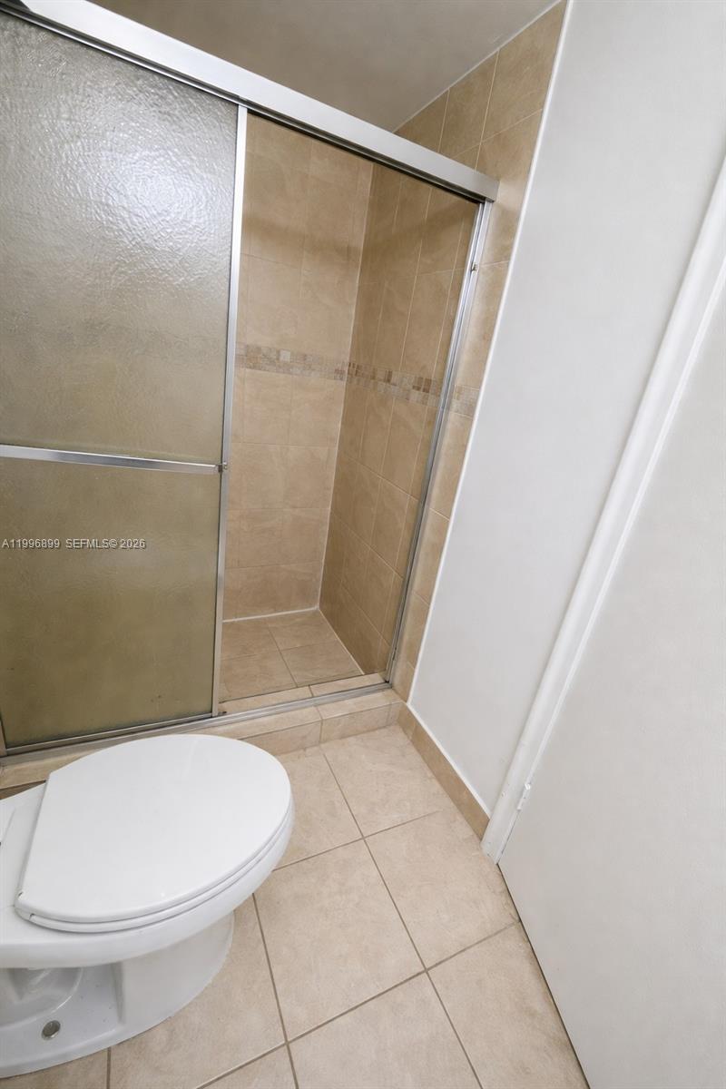 2521 Pierce Street, Unit 2 Hollywood, FL 33020 - Photo 10 of 11 a bathroom with a toilet and a shower