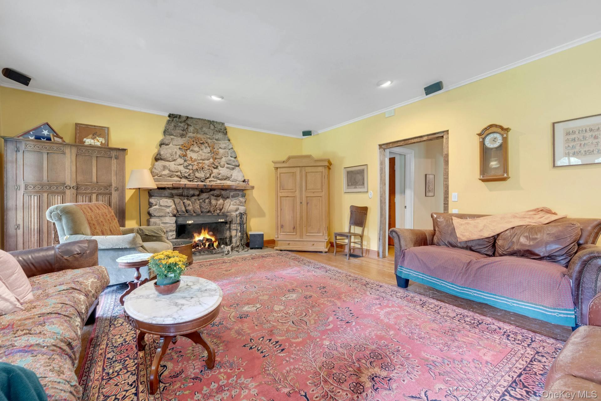 209 Hardscrabble Road North Salem, NY 10560 - Photo 17 of 40 a living room with furniture and a fireplace