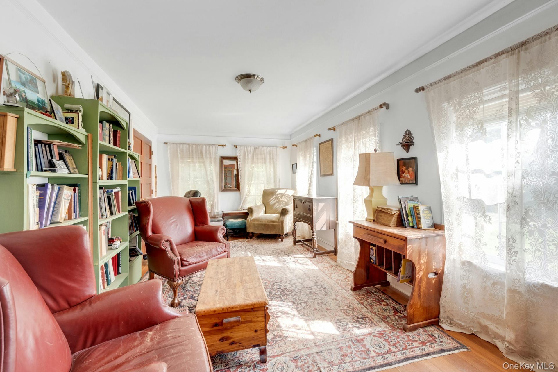 209 Hardscrabble Road North Salem, NY 10560 - Photo 18 of 40 a living room with furniture a bookshelf and a window
