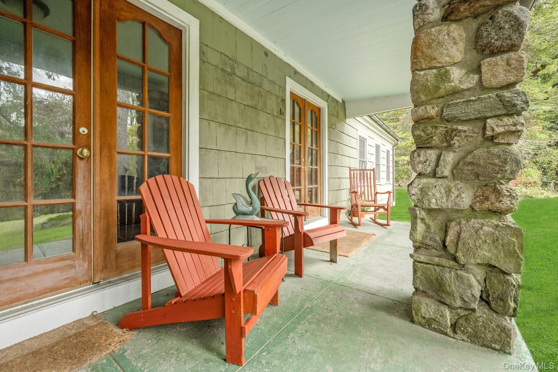 209 Hardscrabble Road North Salem, NY 10560 - Photo 26 of 40 a view of a porch with chairs and backyard