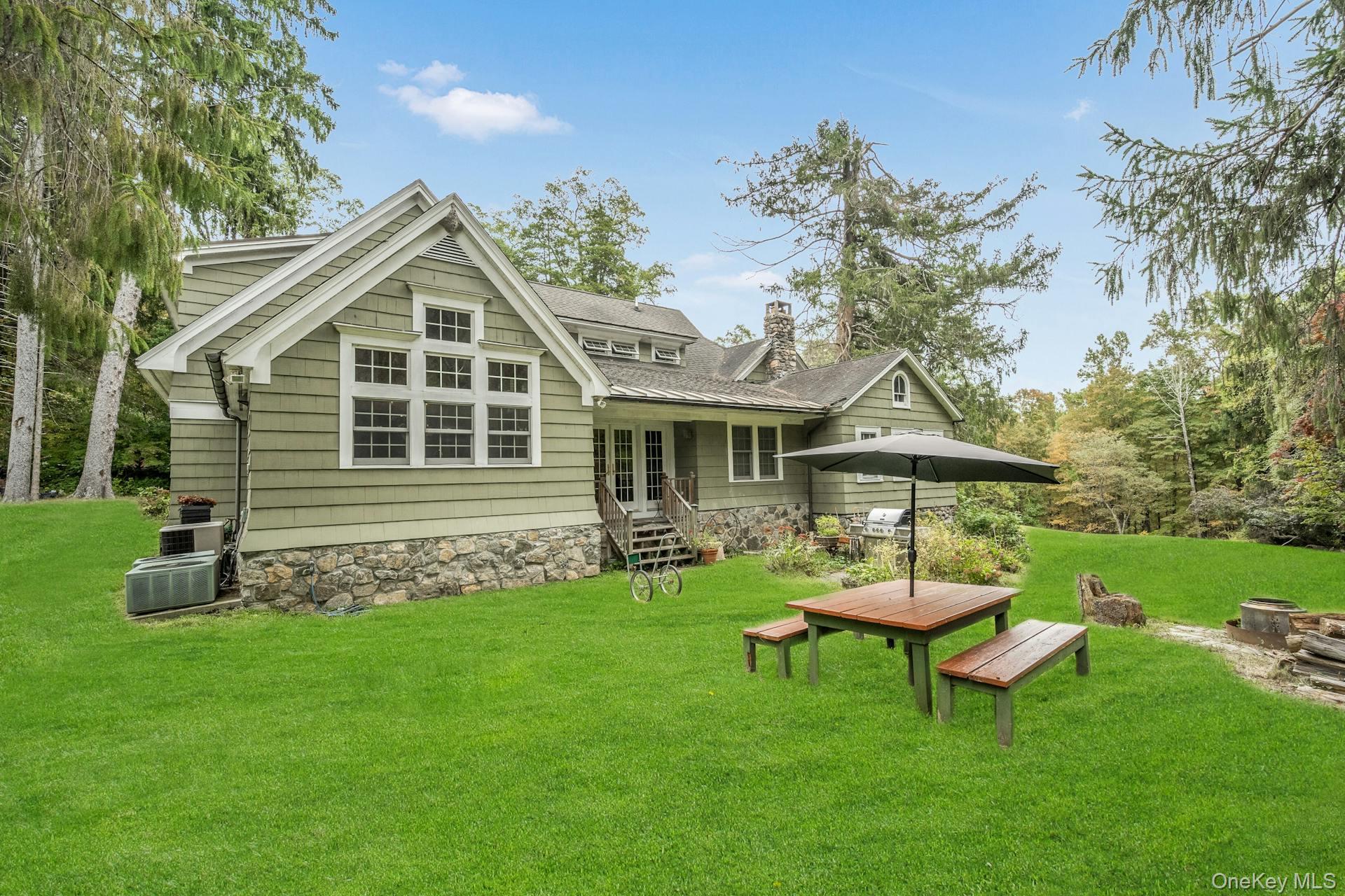209 Hardscrabble Road North Salem, NY 10560 - Photo 27 of 40 a view of a wooden bench sitting in the grass
