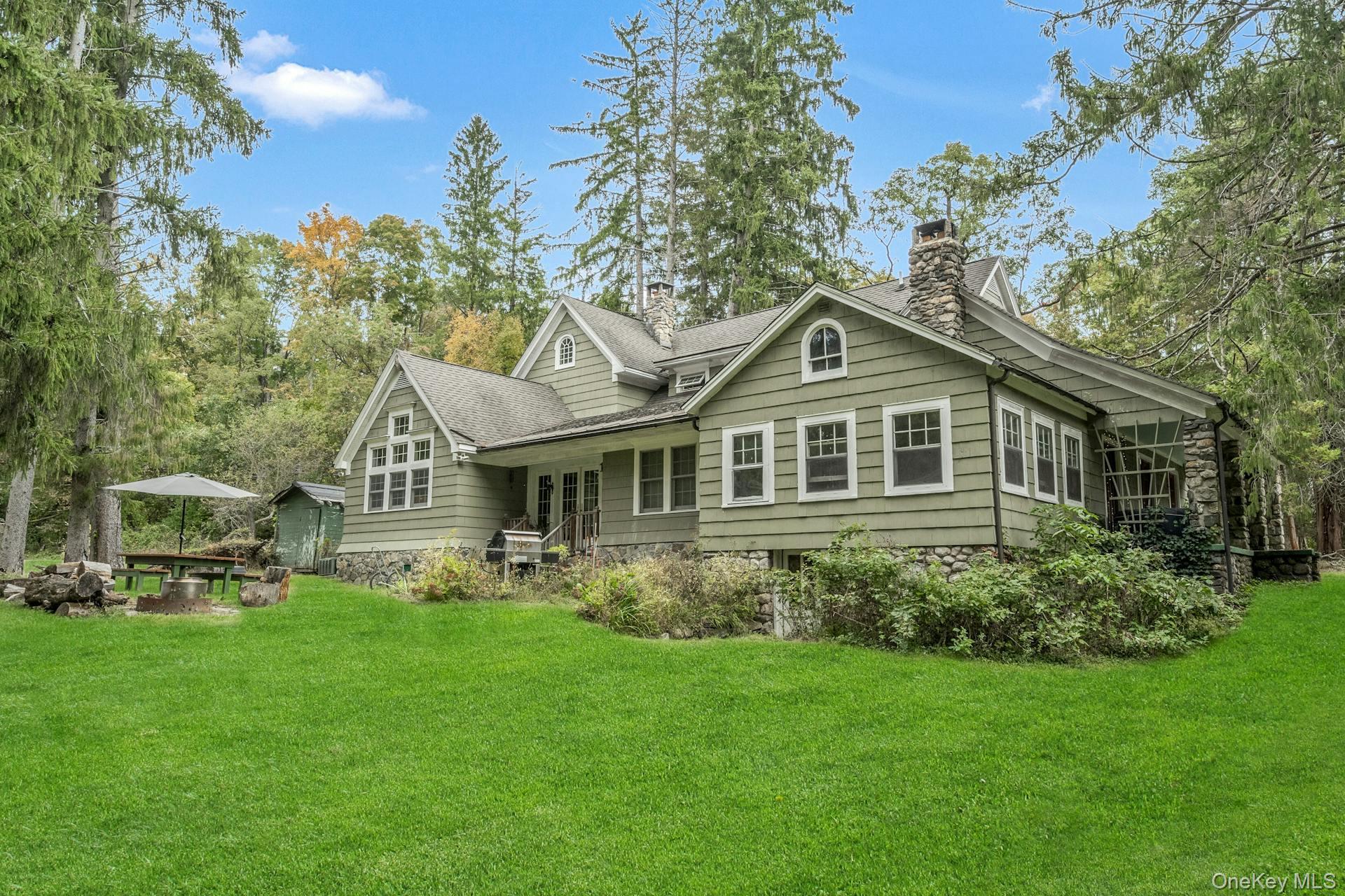 209 Hardscrabble Road North Salem, NY 10560 - Photo 29 of 40 a front view of a house with a garden and trees