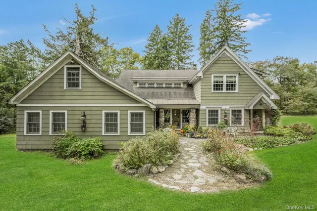 a backyard of a house with outdoor seating