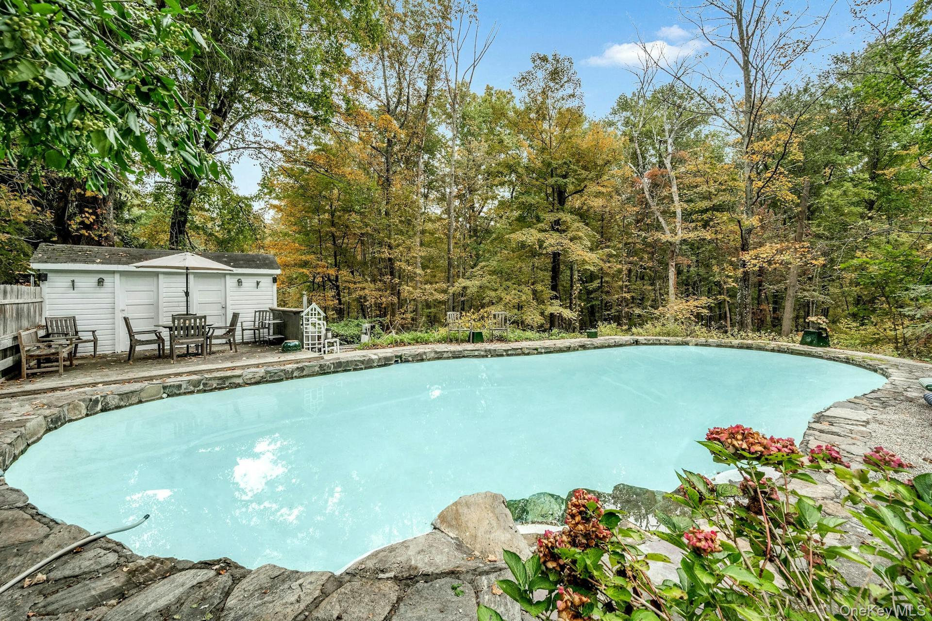 209 Hardscrabble Road North Salem, NY 10560 - Photo 31 of 40 a view of a swimming pool with an outdoor seating