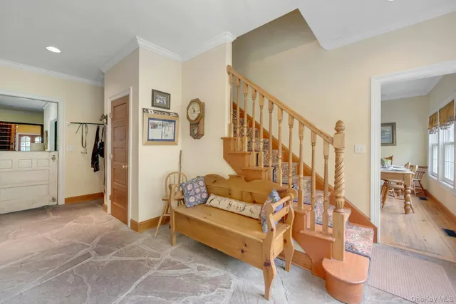 a view of a livingroom with furniture and an entryway
