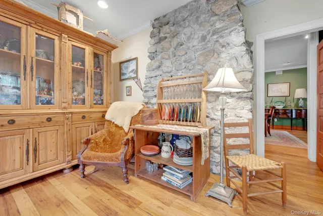 a view of a dining room with furniture large windows and wooden floor