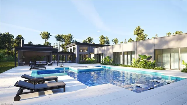 a living room with patio furniture and a potted plant