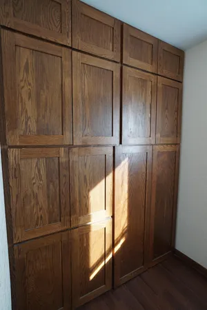 a bedroom with bed and a television