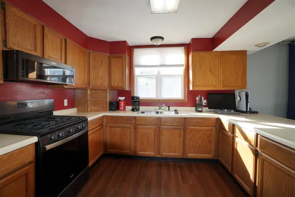 a bedroom with a bed closet and a window