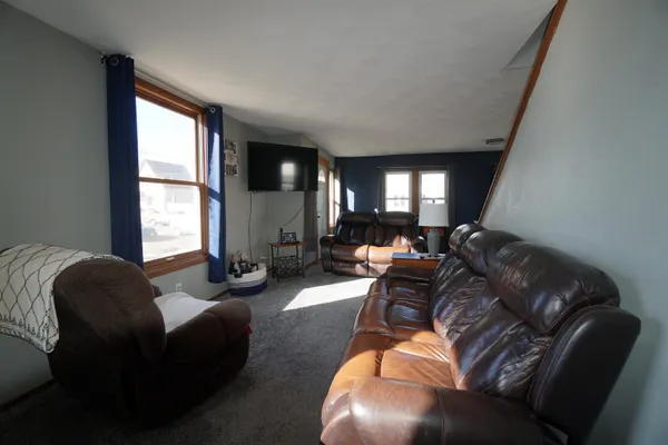 a living room with furniture window and gym equipment