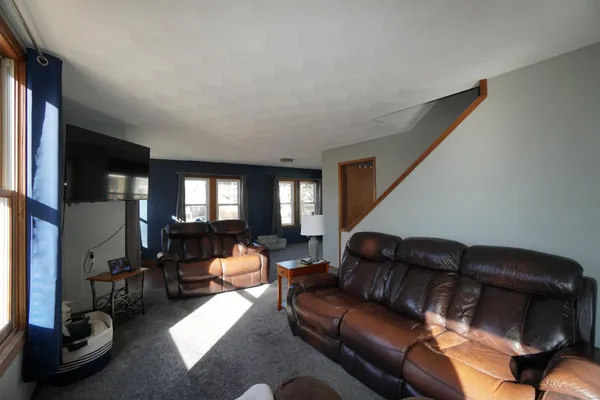 a living room with furniture and windows
