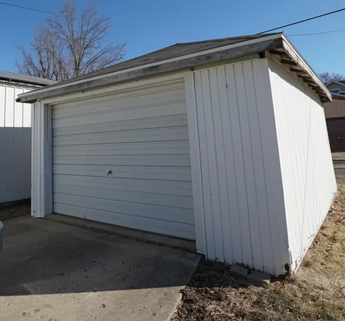 a living room with furniture a flat screen tv and a couch