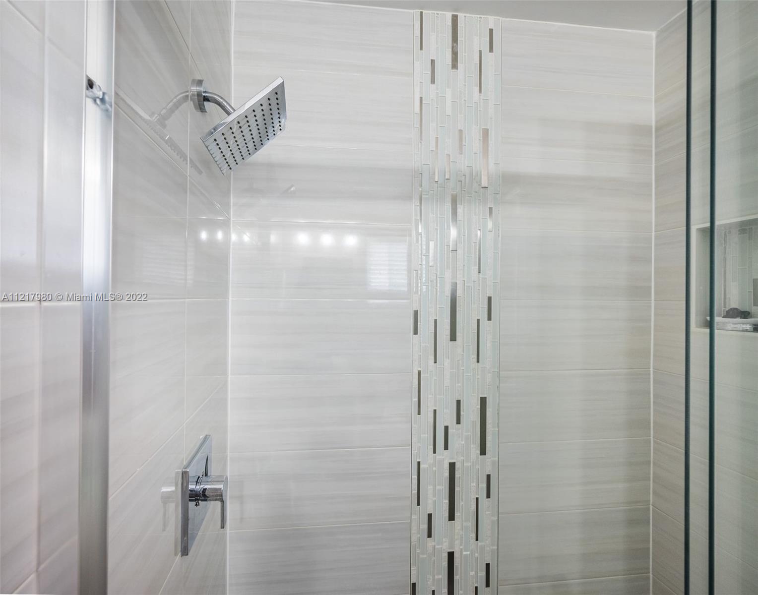 1418 Sandpiper Circle Weston, FL 33327 - Photo 23 of 31 a bathroom with a glass shower door
