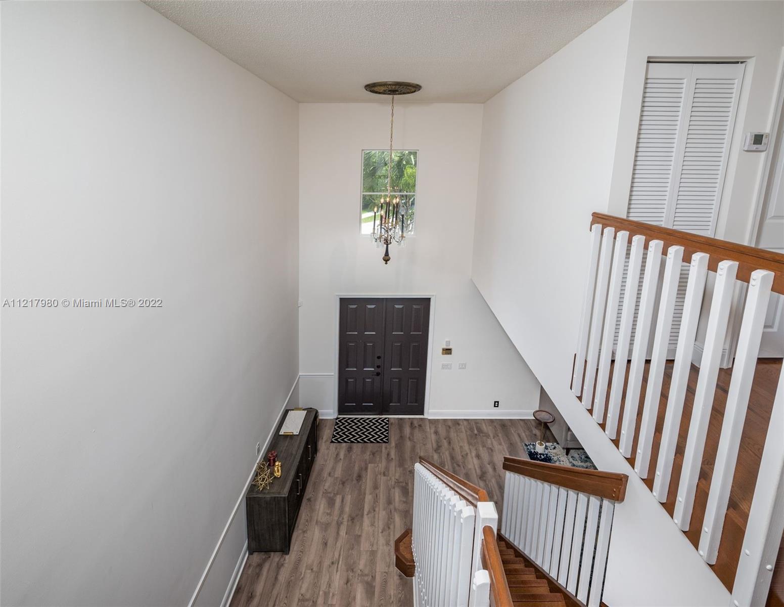 1418 Sandpiper Circle Weston, FL 33327 - Photo 24 of 31 a view of entryway with wooden floor