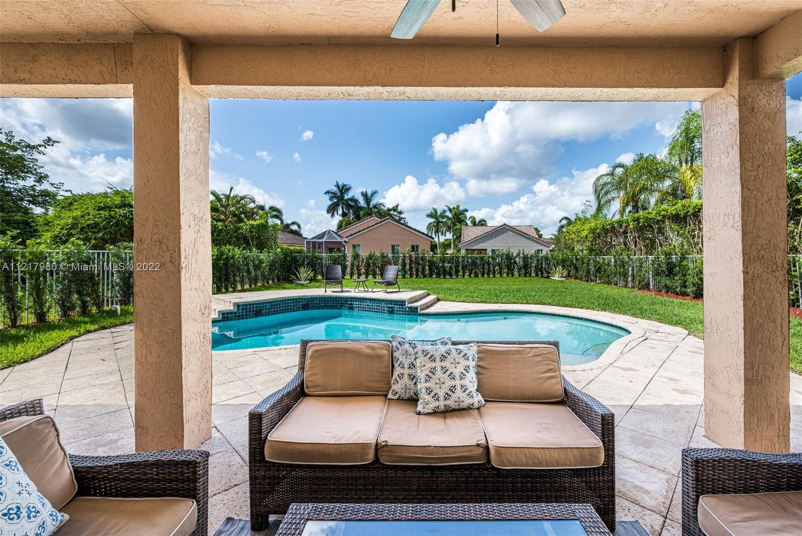 1418 Sandpiper Circle Weston, FL 33327 - Photo 25 of 31 a view of swimming pool with seating area and barbeque oven
