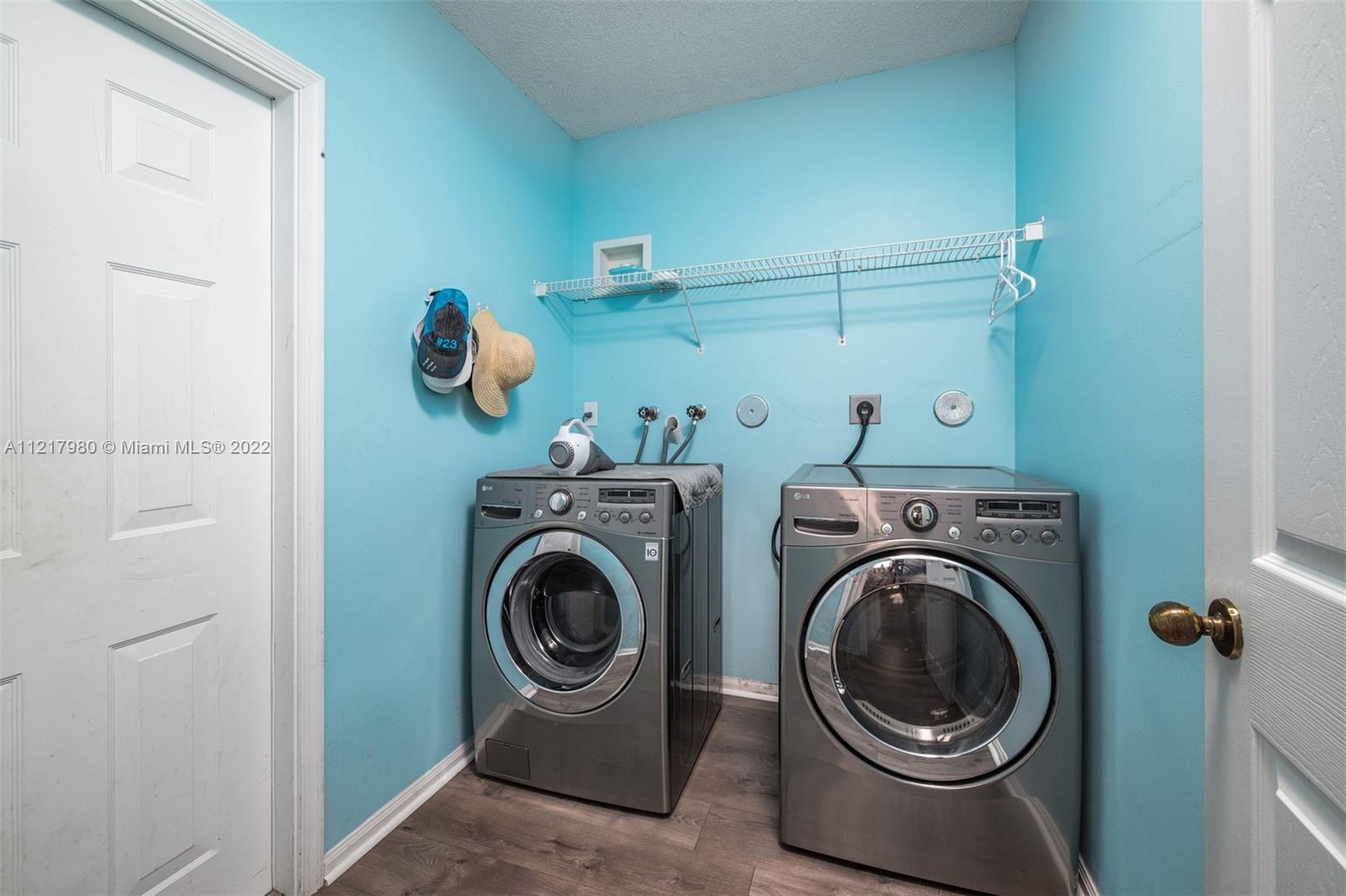 1418 Sandpiper Circle Weston, FL 33327 - Photo 29 of 31 a utility room with dryer and washer