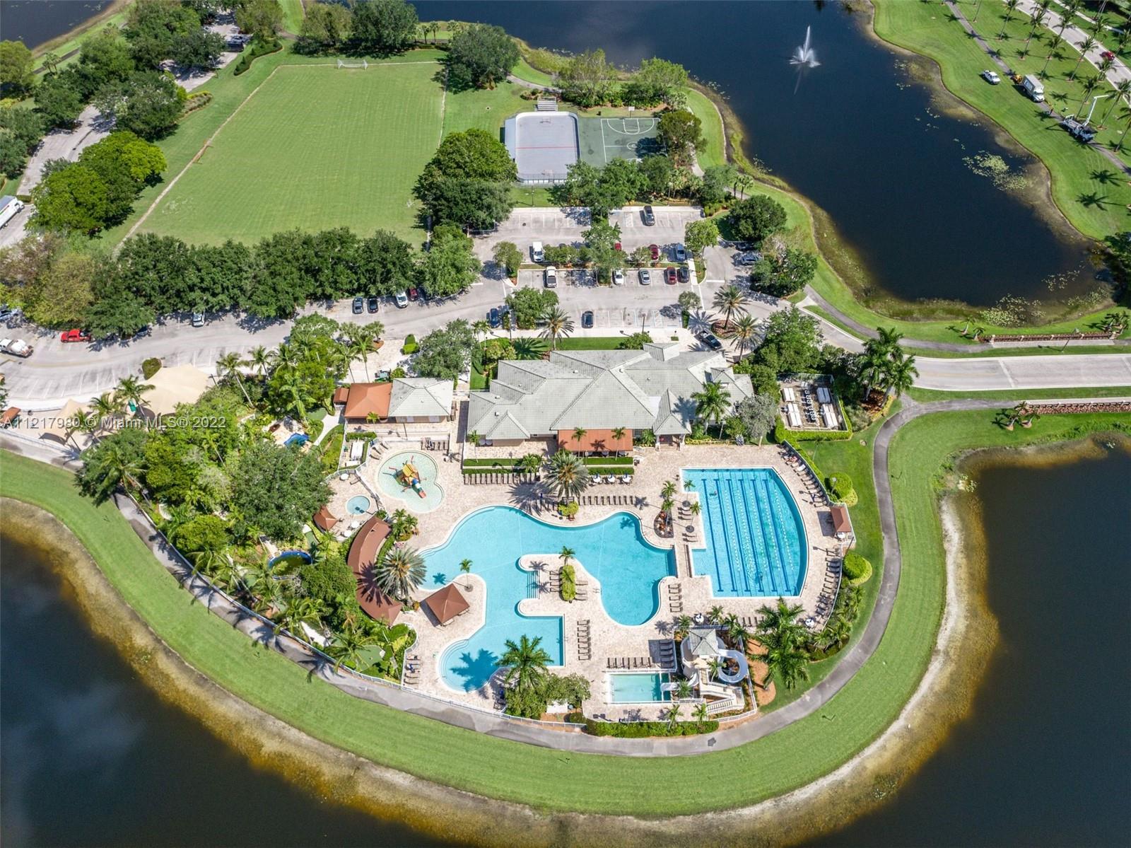 1418 Sandpiper Circle Weston, FL 33327 - Photo 30 of 31 a view of a swimming pool with a yard