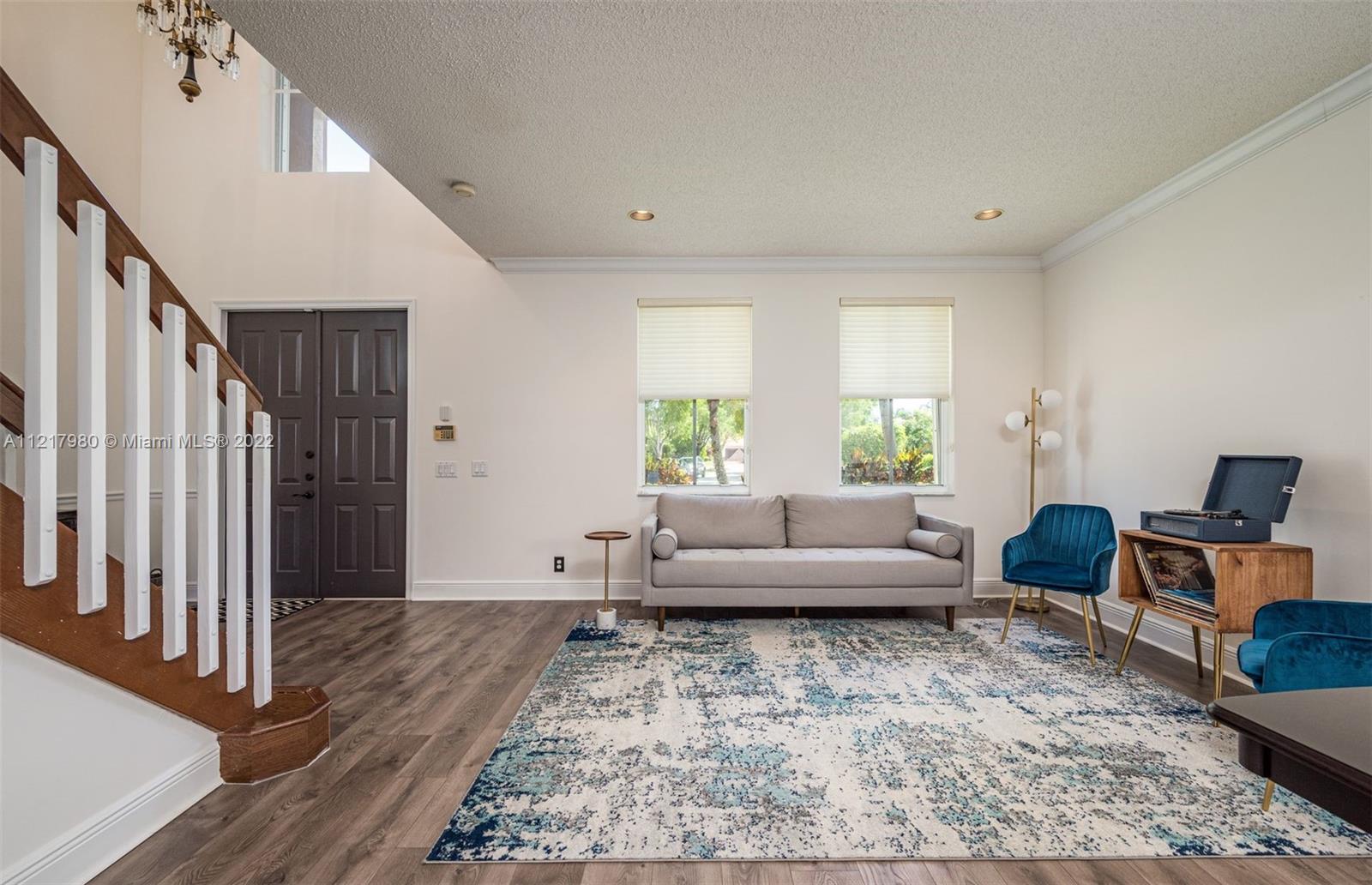 1418 Sandpiper Circle Weston, FL 33327 - Photo 3 of 31 a living room with furniture and a couch