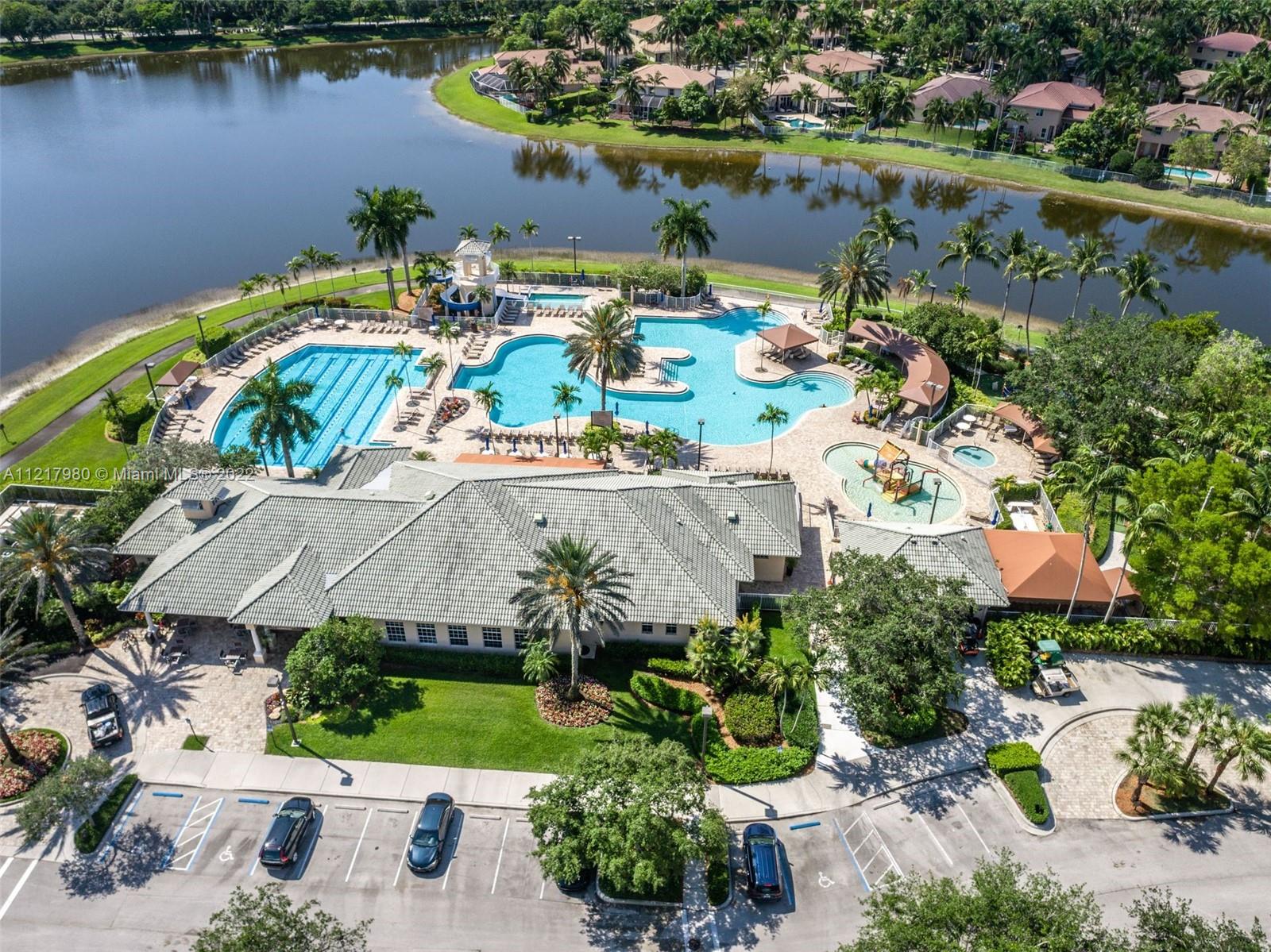 1418 Sandpiper Circle Weston, FL 33327 - Photo 31 of 31 an aerial view of a house with a lake view