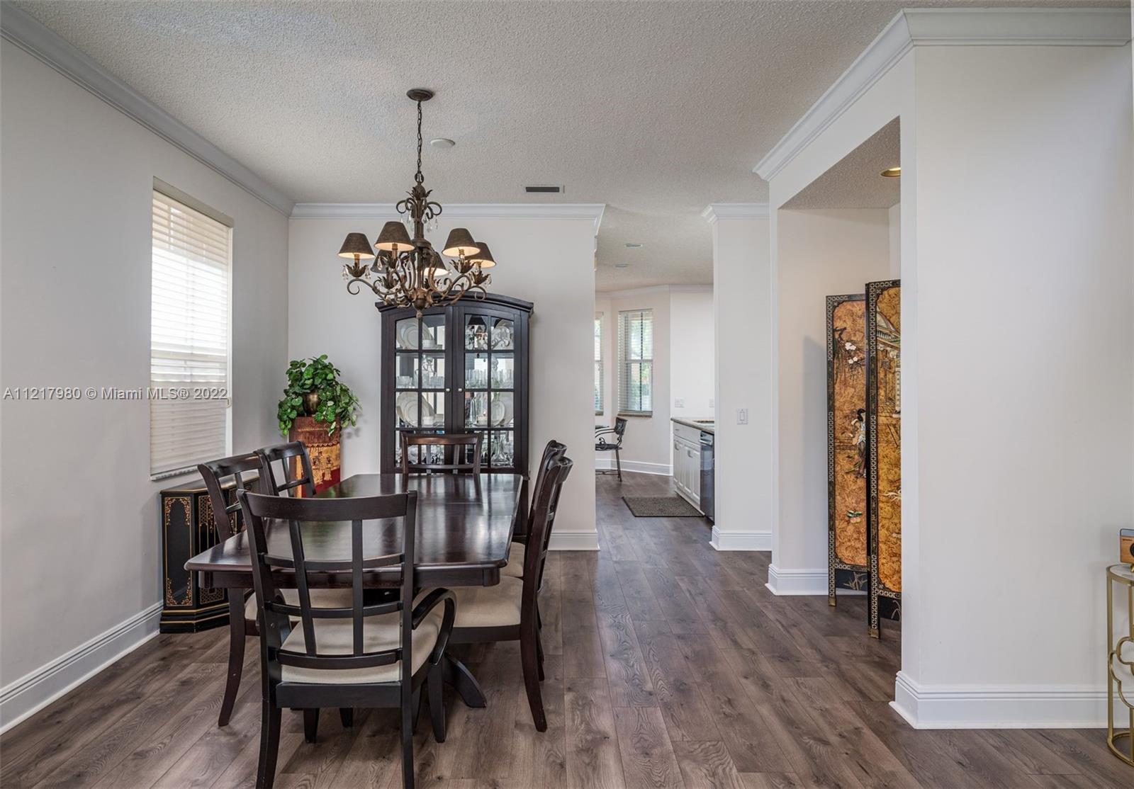 1418 Sandpiper Circle Weston, FL 33327 - Photo 4 of 31 a dining room with furniture and window