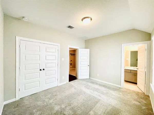 a view of a livingroom with wooden closet
