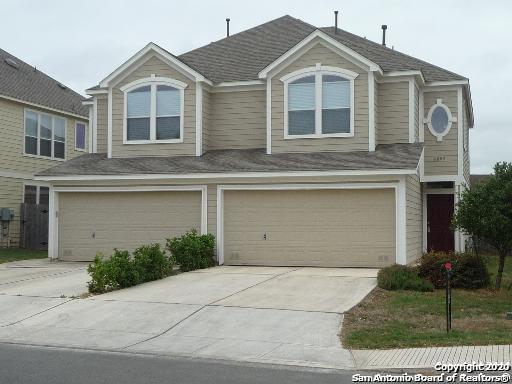 6802 Terra Rye San Antonio, TX 78240 - Photo 1 of 17 a front view of a house with a yard and garage