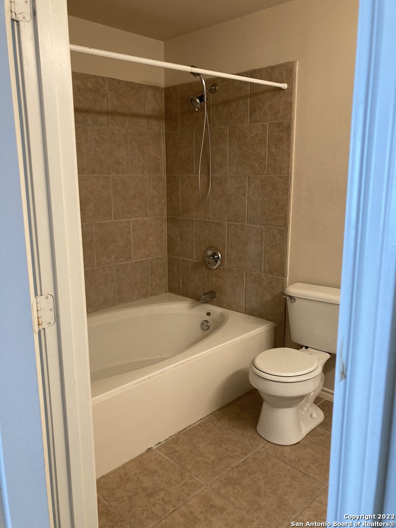 6802 Terra Rye San Antonio, TX 78240 - Photo 12 of 17 a bathroom with a toilet and a bathtub