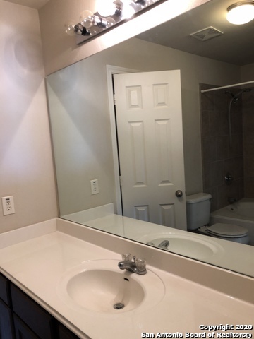 6802 Terra Rye San Antonio, TX 78240 - Photo 10 of 17 a bathroom with a sink and a mirror